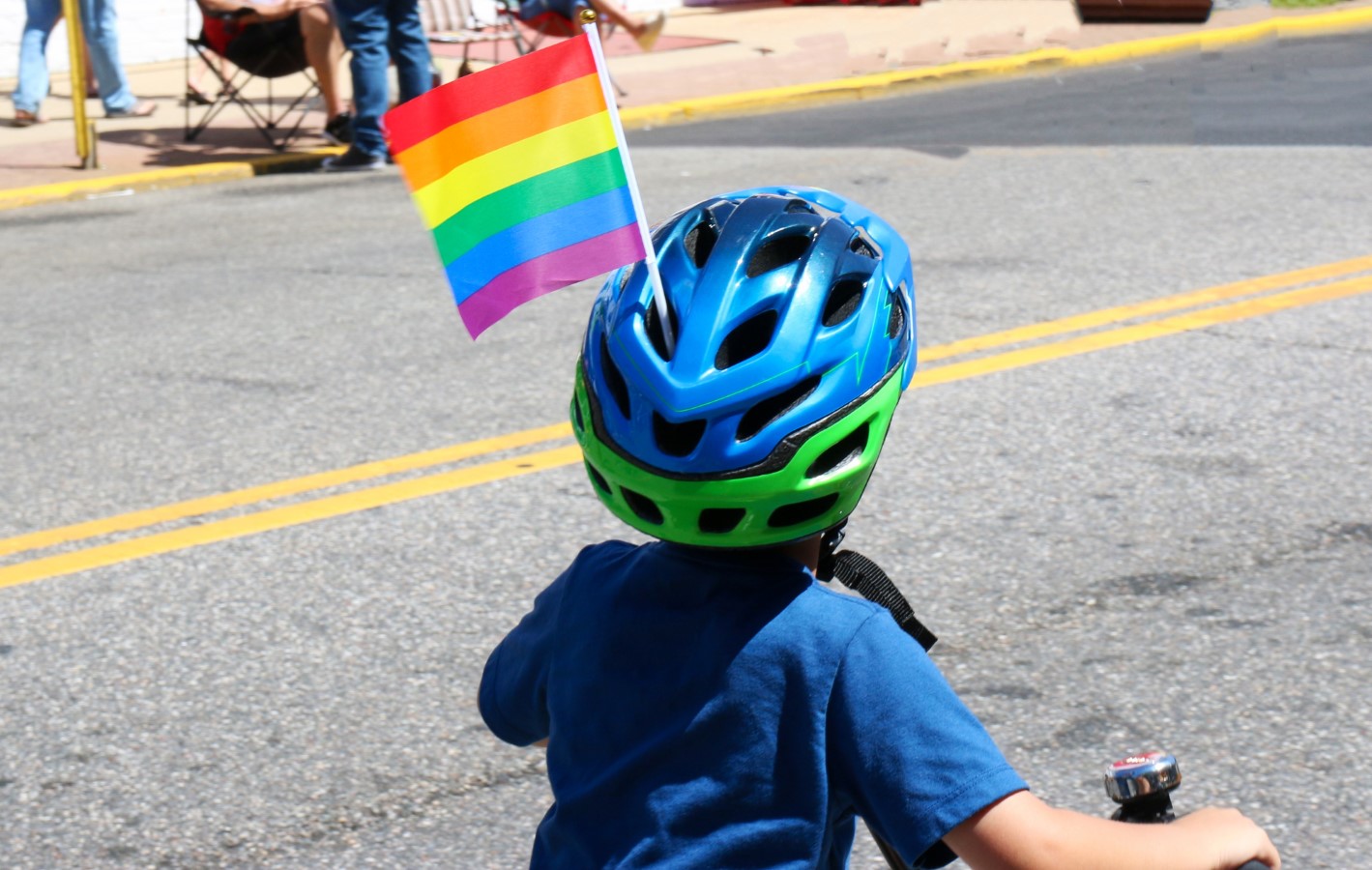 kid waving pride flag