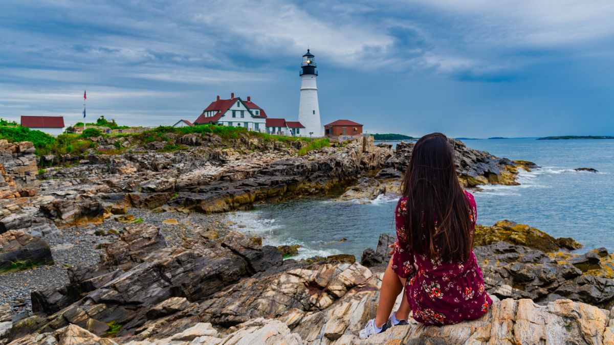 woman on rock in new england states
