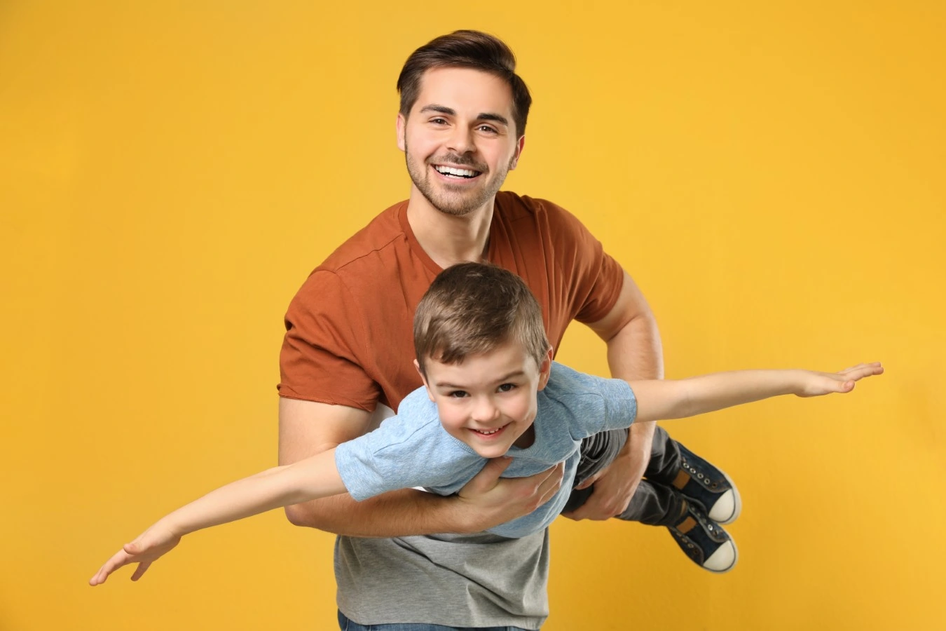 father and son playing