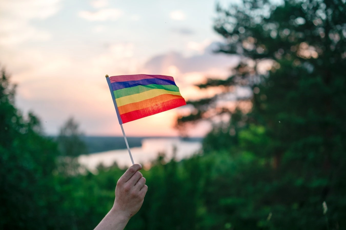 holding rainbow flag