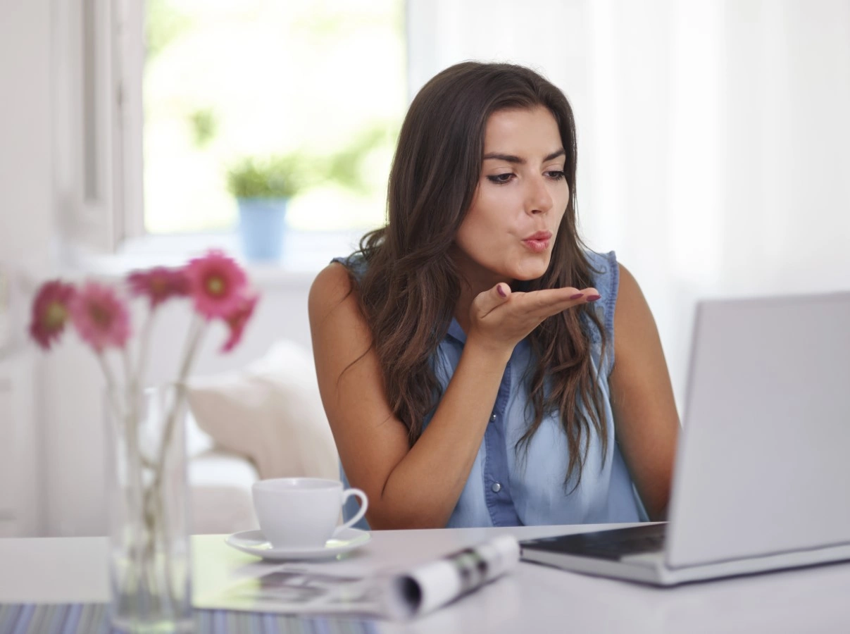 woman blowing kiss online