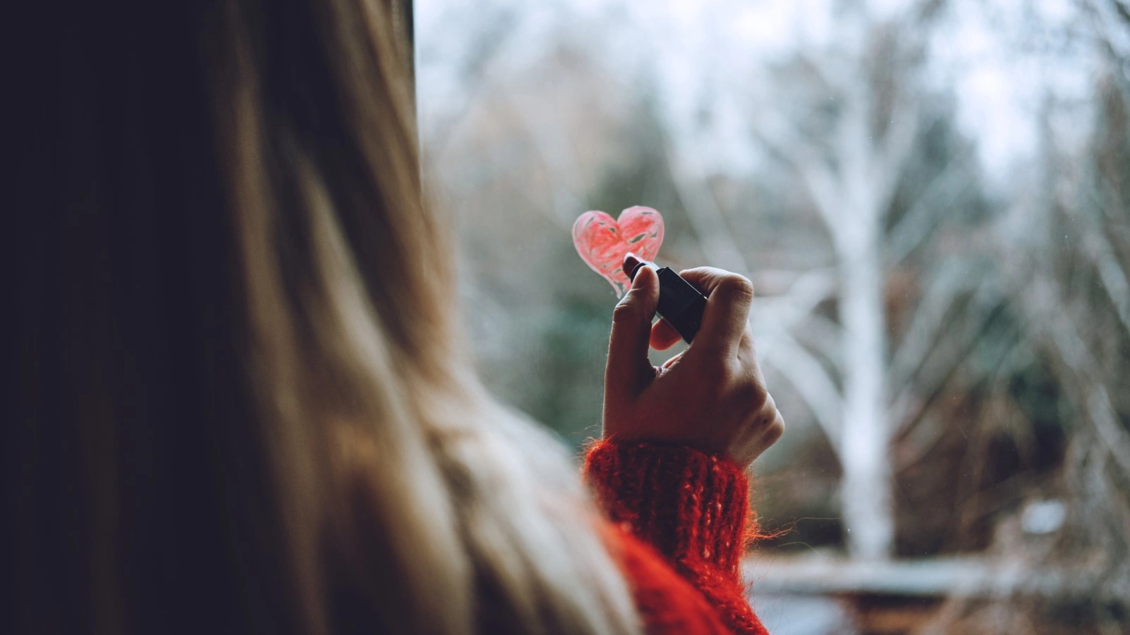 woman looking at heart