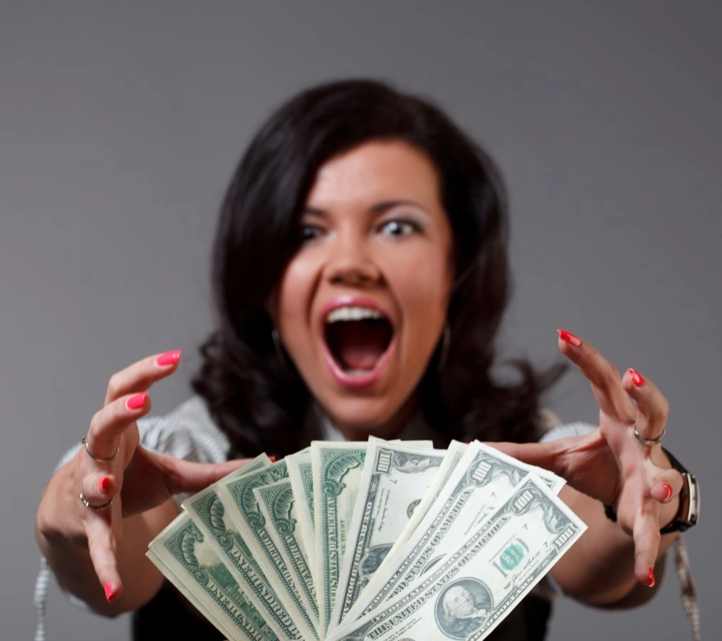 This image has an empty alt attribute; its file name is woman-taking-money.jpg