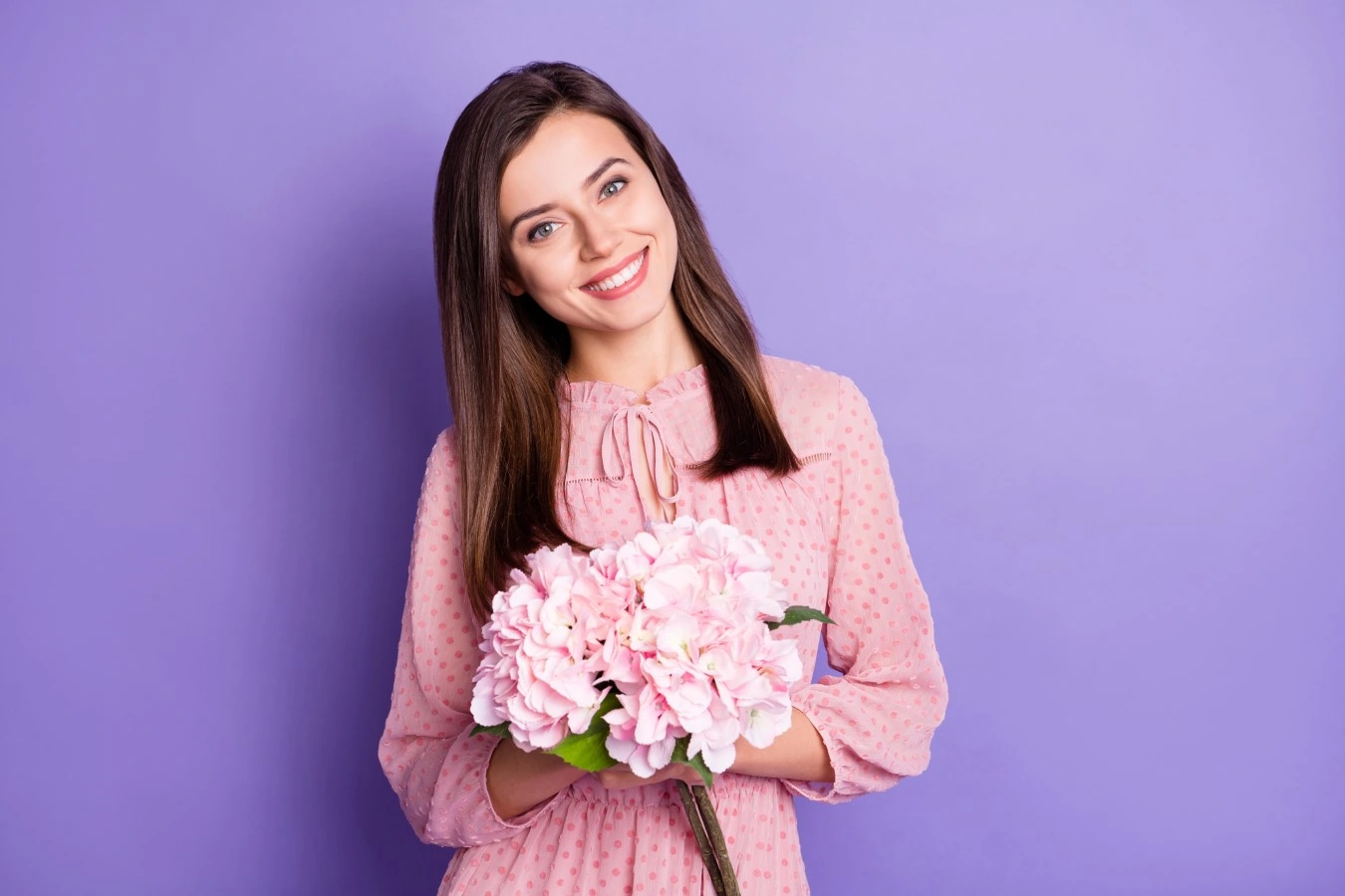womn carrying flowers